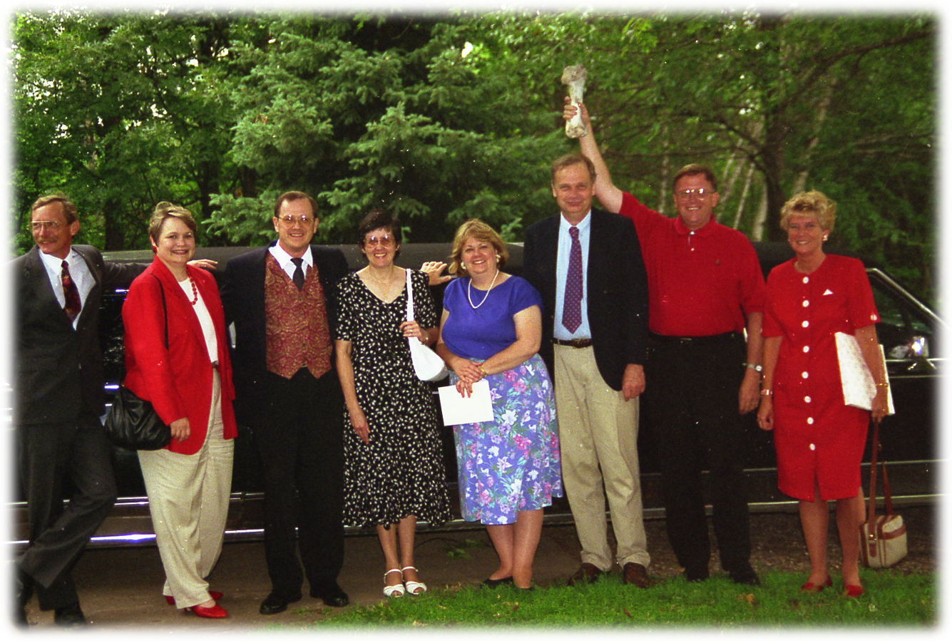 A group of people posing for a photo

Description automatically generated