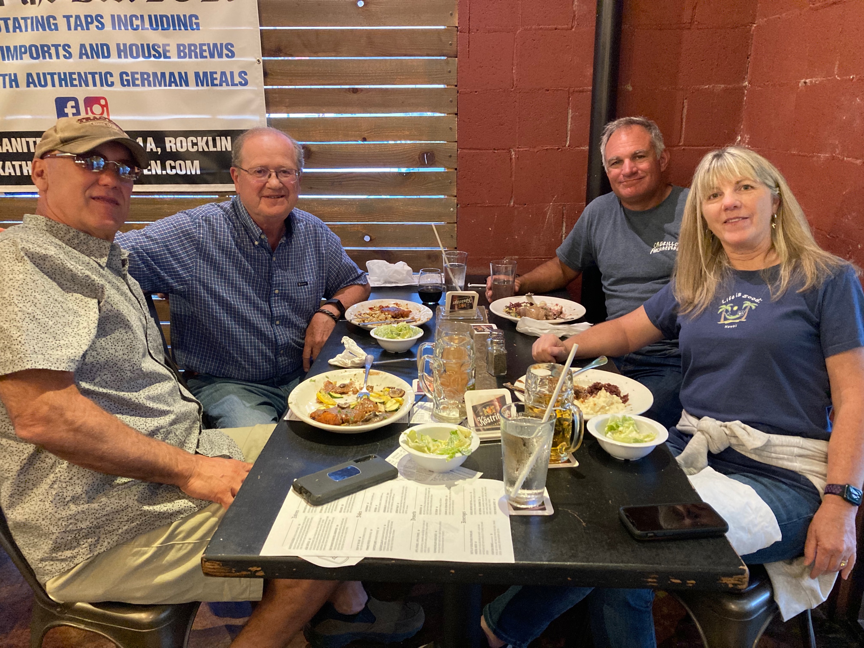 A group of people sitting at a table with food
Description automatically generated with medium confidence