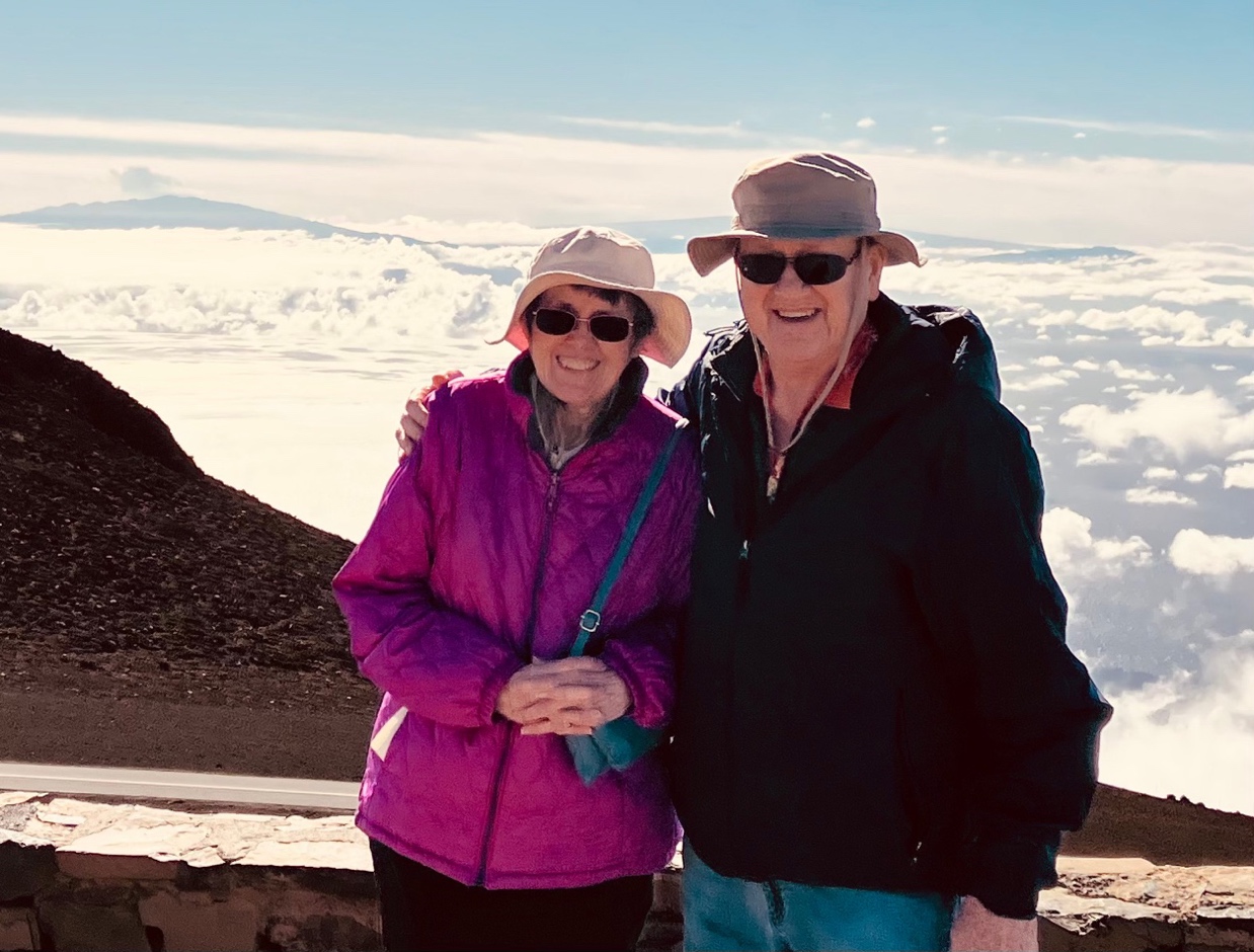 A person and person standing on a mountain

AI-generated content may be incorrect.