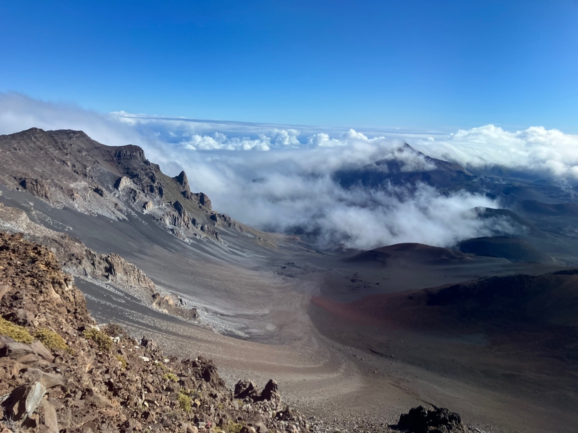 Haleakalā landscape with clouds above

AI-generated content may be incorrect.