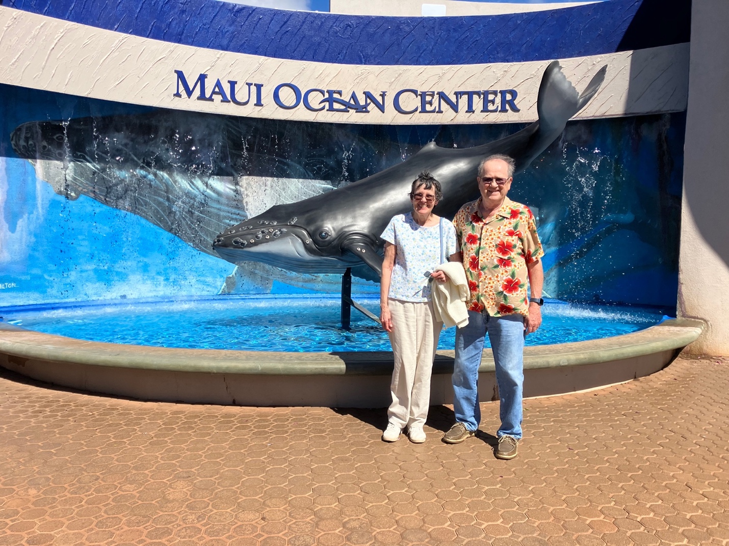A couple standing in front of a whale statue

AI-generated content may be incorrect.